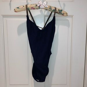 Swimsuit. Black  One piece with animal strap. Too hot Brazil.